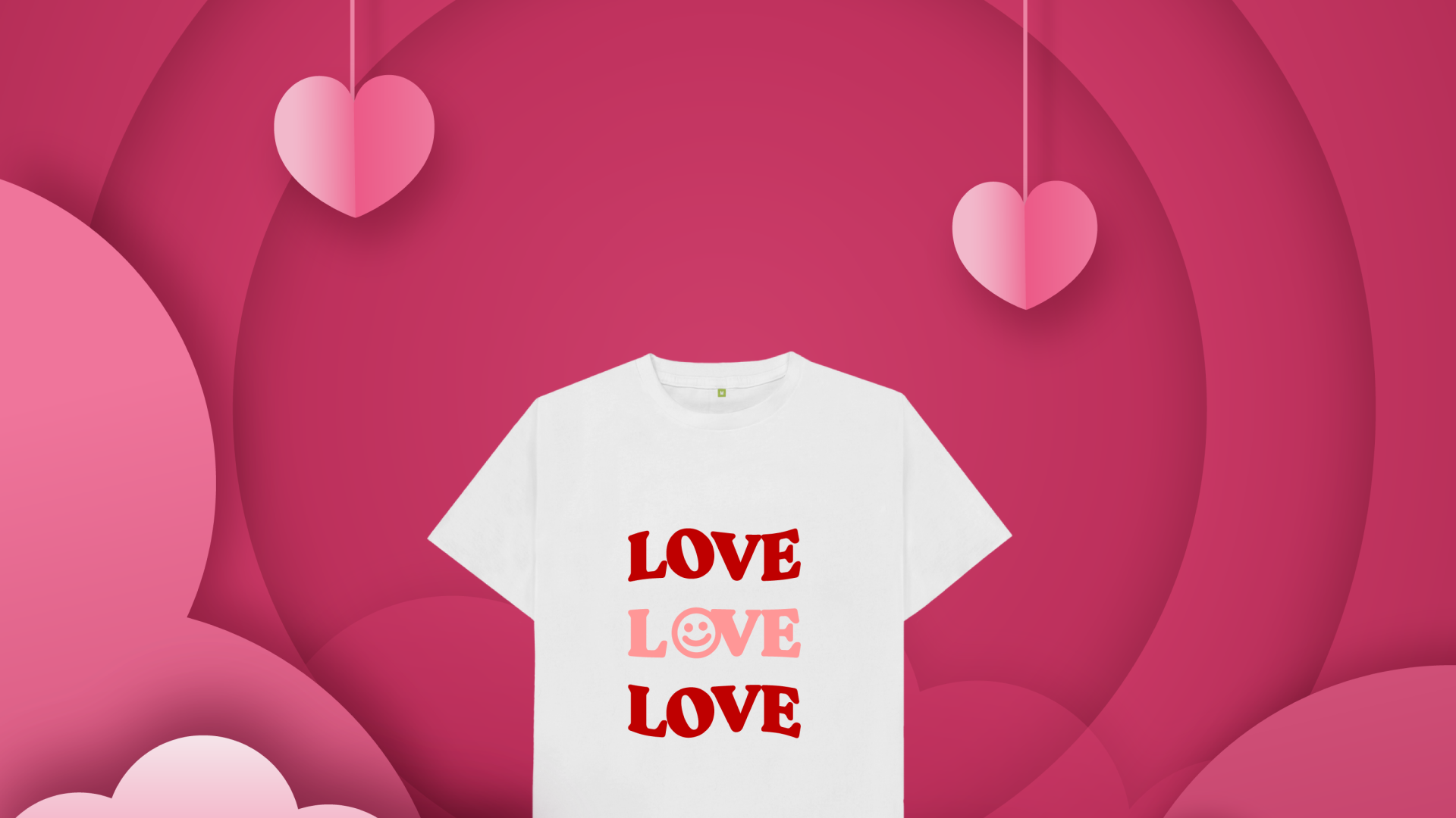 A t-shirt with love written with a pink back ground with hearts