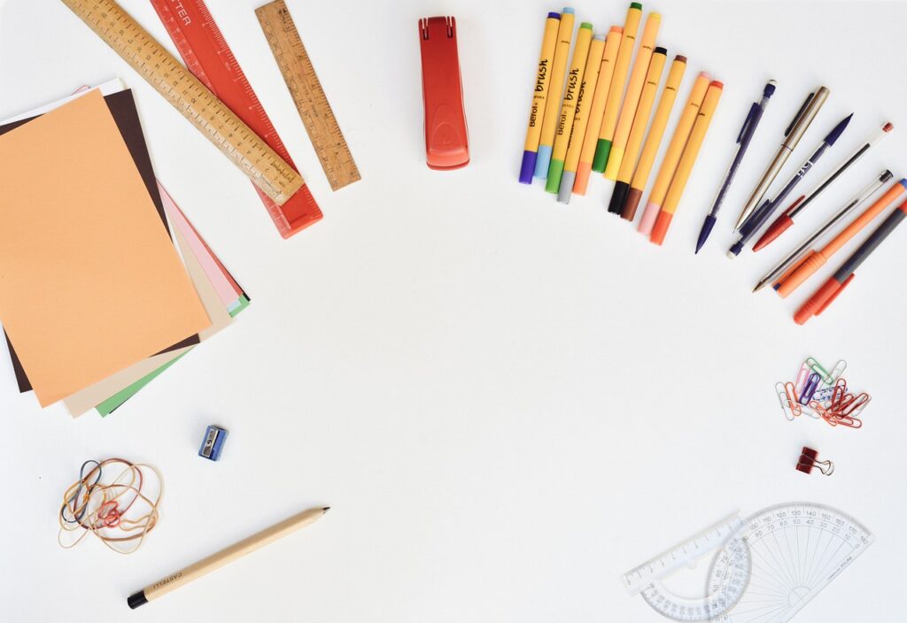 An array of stationery, including pens, paper, and other supplies